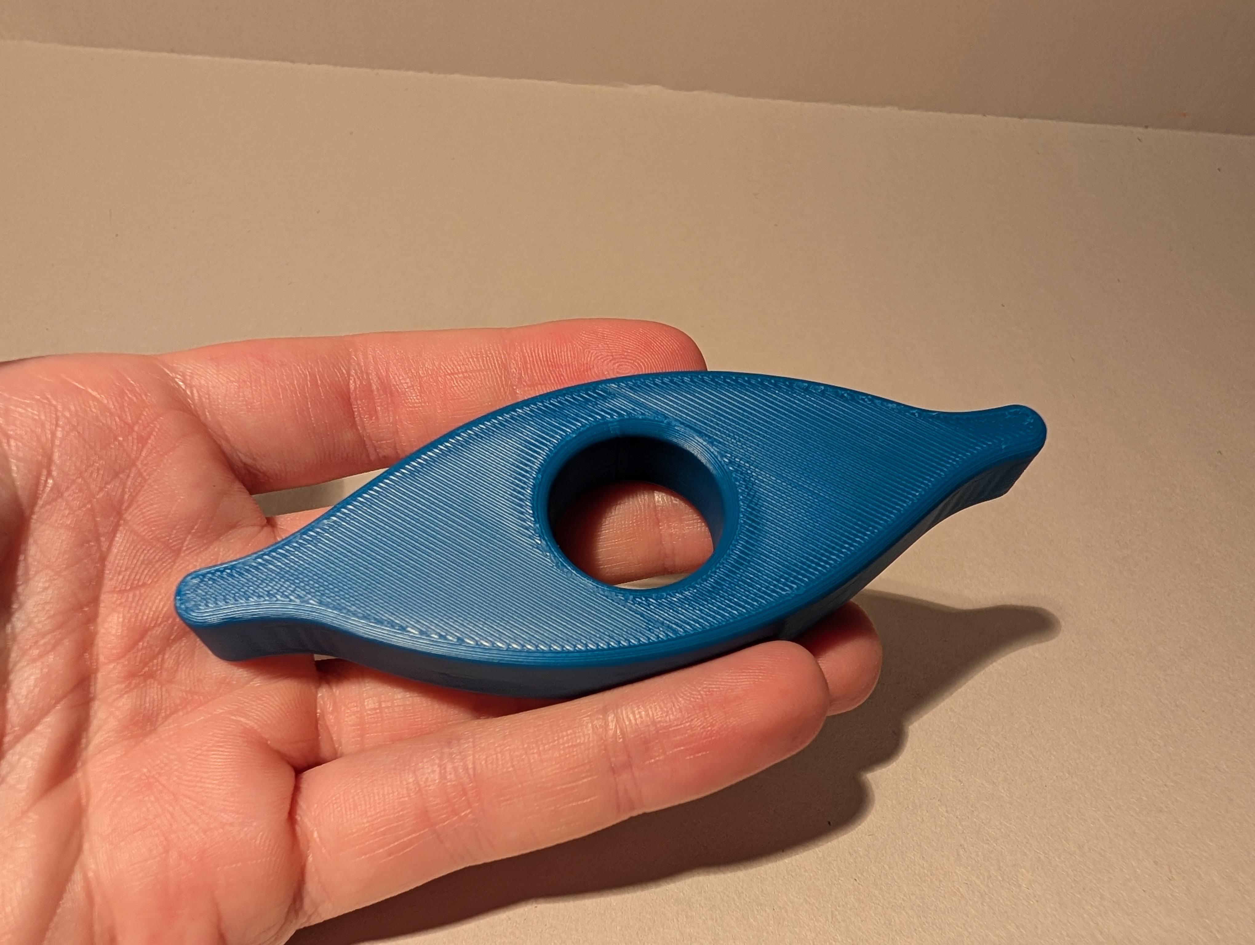 Blue 3D printed Book Holder shown in hand